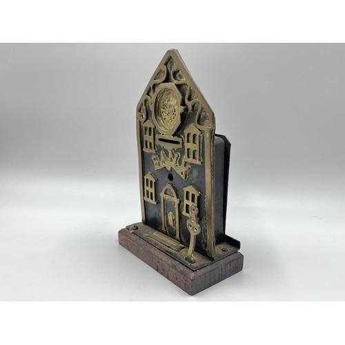 2272 - A Victorian brass and iron novelty bank money box - approx. 19cm high