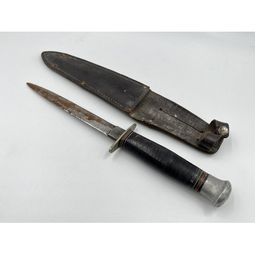 2275 - A WWII British William Rodgers commando dagger with leather sheath