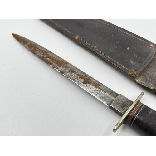 2275 - A WWII British William Rodgers commando dagger with leather sheath