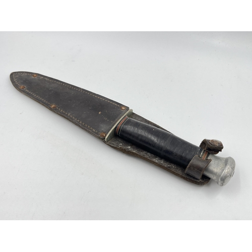 2275 - A WWII British William Rodgers commando dagger with leather sheath