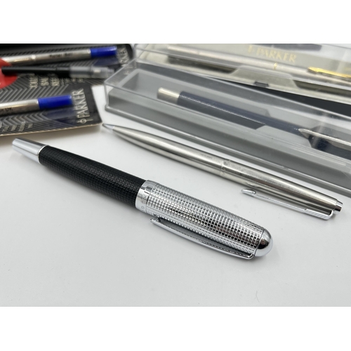 2277 - A collection of writing instruments to include Hugo Boss fountain pen, Parker etc.