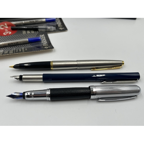 2277 - A collection of writing instruments to include Hugo Boss fountain pen, Parker etc.