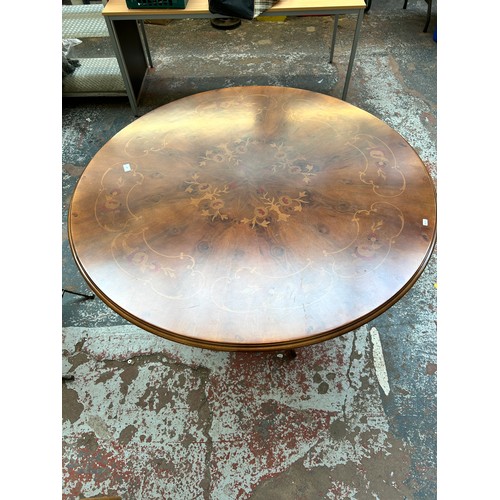 200 - An Italian style inlaid walnut effect circular pedestal dining table