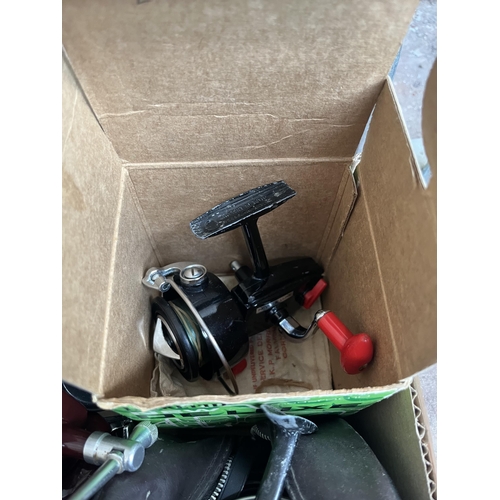 A boxed Mitchell 320 spinning reel