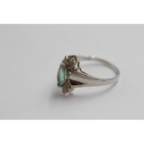 2007 - A 9ct white gold diamond and emerald half halo ring - approx. gross weight 3g