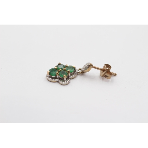 2009 - A pair of 9ct gold diamond and emerald ornate drop earrings - approx. gross weight 1.8g