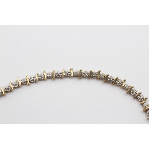 2015 - A 9ct gold diamond twist bracelet - approx. gross weight 4g