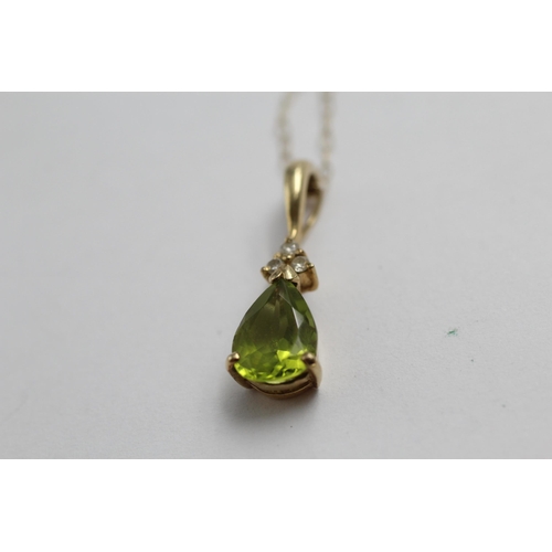 2018 - A 9ct gold diamond and peridot tear drop pendant necklace - approx. gross weight 1.7g