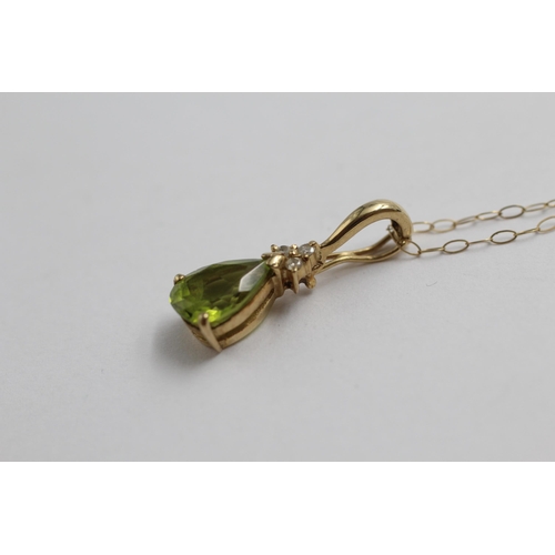 2018 - A 9ct gold diamond and peridot tear drop pendant necklace - approx. gross weight 1.7g