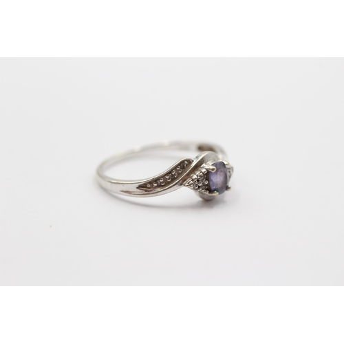 2026 - A 9ct white gold tanzanite and diamond twist ring - approx. gross weight 1.9g