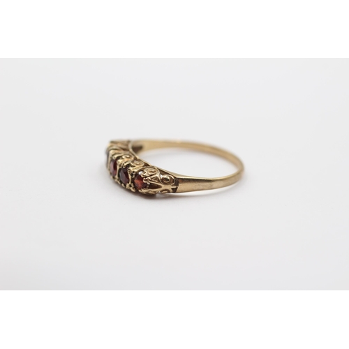 2029 - A 9ct gold garnet five stone ring - approx. gross weight 1.6g