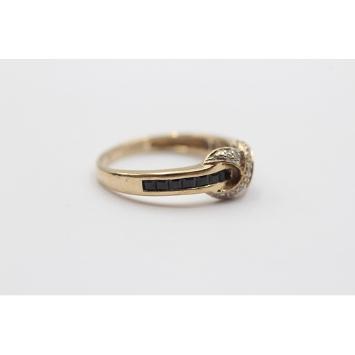 2033 - A 9ct gold diamond and sapphire channel setting twist ring - approx. gross weight 2.6g