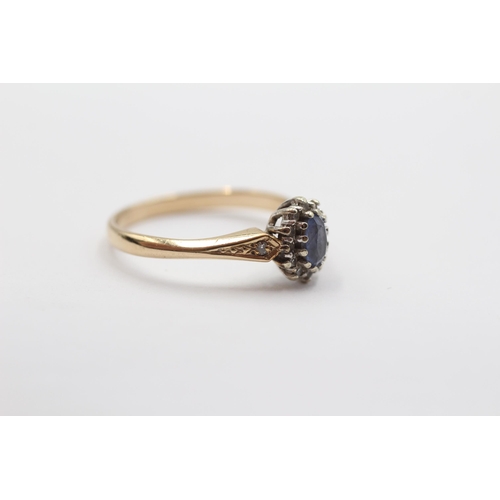 2036 - A 9ct gold diamond and sapphire halo ring - approx. gross weight 2.3g