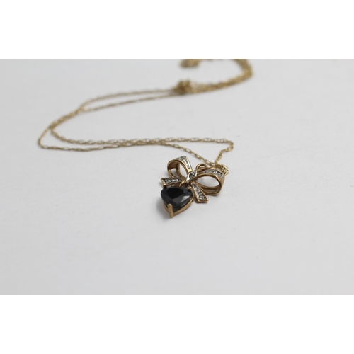 2050 - A 9ct gold sapphire and diamond ribbon drop heart pendant necklace and earrings set - approx. gross ... 