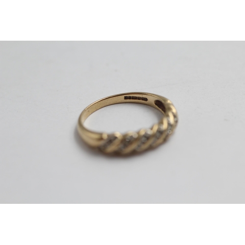 2057 - A 9ct gold diamond stylised half-eternity dress ring - approx. gross weight 2.3g