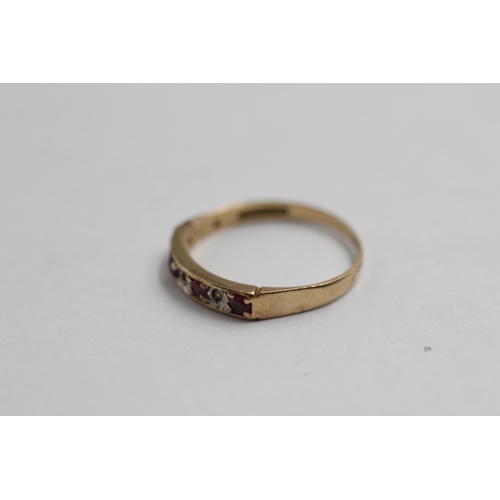 2060 - A 9ct gold ruby and diamond gypsy setting ring - approx. gross weight 1.2g