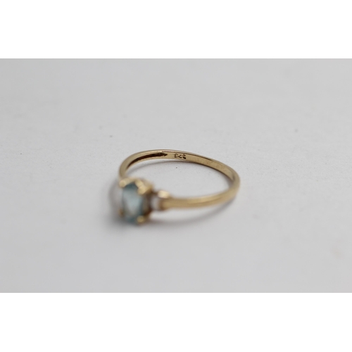 2062 - A 9ct gold blue topaz solitaire ring - approx. gross weight 0.9g