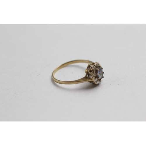 2063 - A 9ct gold sapphire and diamond halo dress ring - approx. gross weight 1.5g