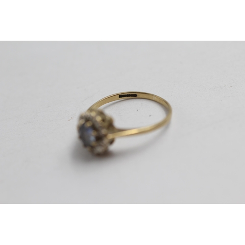 2063 - A 9ct gold sapphire and diamond halo dress ring - approx. gross weight 1.5g