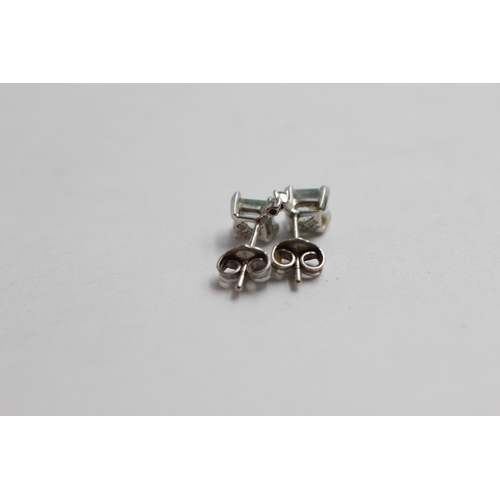 2065 - A pair of 9ct white gold topaz and diamond stud earrings - approx. gross weight 0.8g