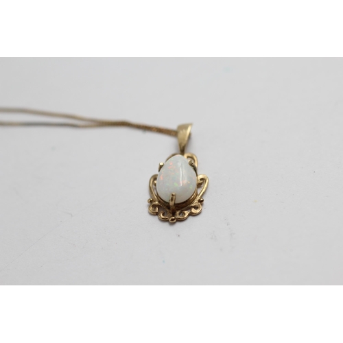 2069 - A 9ct gold opal solitaire pendant necklace - approx. gross weight 1.1g