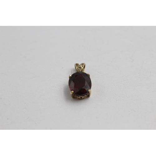 2076 - Four 9ct gold gemstone pendants to include garnet and diamond, sapphire and diamond, topaz etc. - ap... 