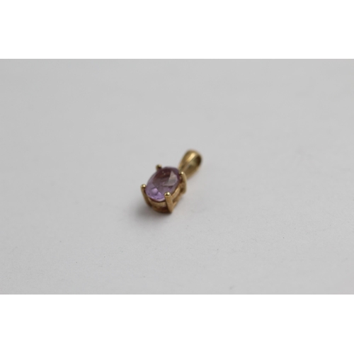 2077 - Three 9ct gold gemstone amethyst pendants, one with diamond - approx. gross weight 1.8g