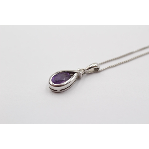 2082 - A 9ct white gold diamond and amethyst twist drop pendant necklace - approx. gross weight 1.5g