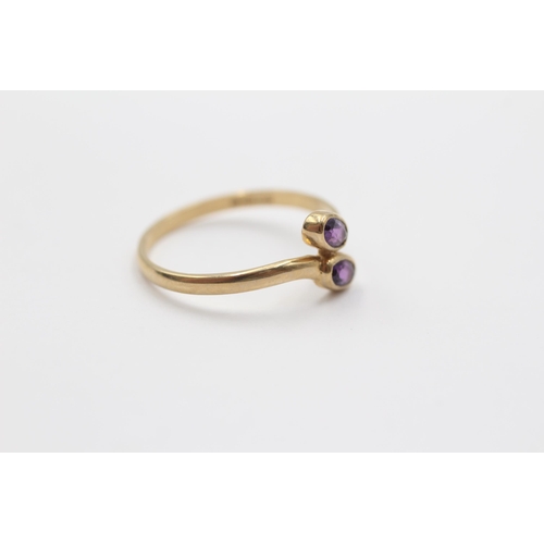 2086 - A 9ct gold amethyst bypass ring, size P½ - approx. gross weight 1.3g