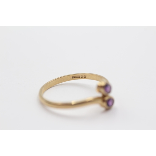 2086 - A 9ct gold amethyst bypass ring, size P½ - approx. gross weight 1.3g