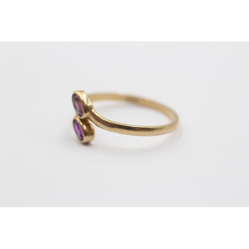 2086 - A 9ct gold amethyst bypass ring, size P½ - approx. gross weight 1.3g