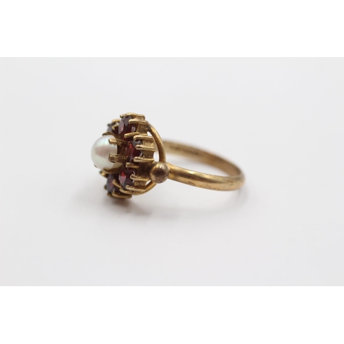 2087 - A 9ct gold garnet and pearl floral ring - approx. gross weight 2.9g