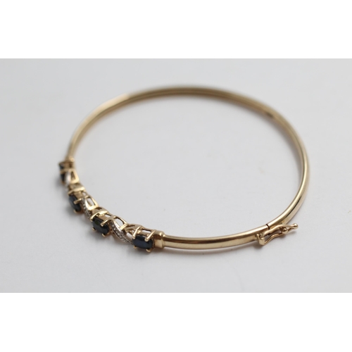 2093 - A 9ct gold sapphire and diamond twist bracelet - approx. gross weight 3.9g