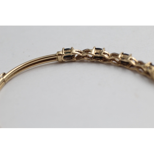 2093 - A 9ct gold sapphire and diamond twist bracelet - approx. gross weight 3.9g