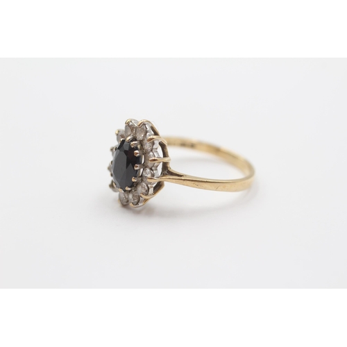 2104 - A 9ct gold sapphire and clear gemstone cluster ring - approx. gross weight 2.7g