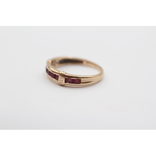 2107 - A 9ct gold ruby channel set ring - approx. gross weight 1.3g