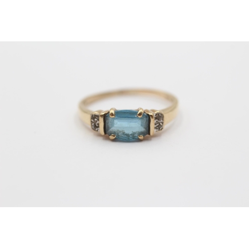 2127 - A 9ct gold blue topaz and diamond five stone dress ring - approx. gross weight 2g