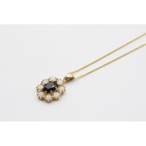 2130 - A 9ct gold sapphire and opal halo pendant necklace - approx. gross weight 2.8g