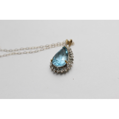 2133 - A 9ct gold blue topaz and diamond teardrop halo pendant necklace - approx. gross weight 3g