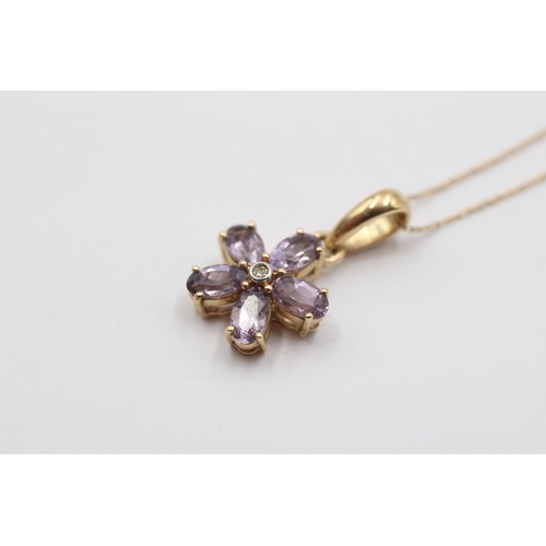 2134 - A 9ct gold tanzanite and diamond floral pendant necklace - approx. gross weight 1.9g