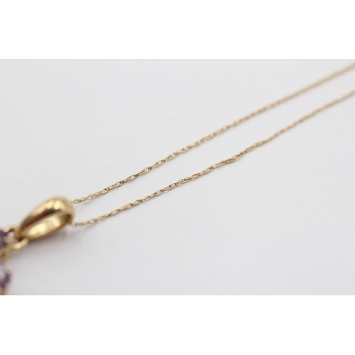 2134 - A 9ct gold tanzanite and diamond floral pendant necklace - approx. gross weight 1.9g