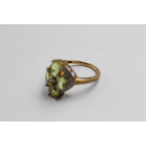 2137 - A 9ct gold peridot and diamond cluster statement ring - approx. gross weight 3g