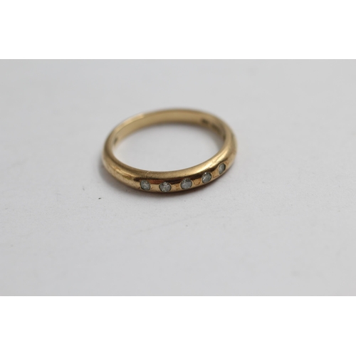 2142 - A 9ct gold diamond flush set ring, size M½ - approx. gross weight 2g