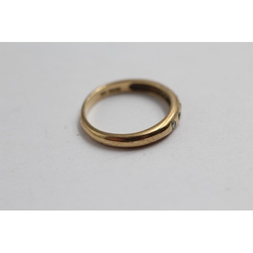 2142 - A 9ct gold diamond flush set ring, size M½ - approx. gross weight 2g