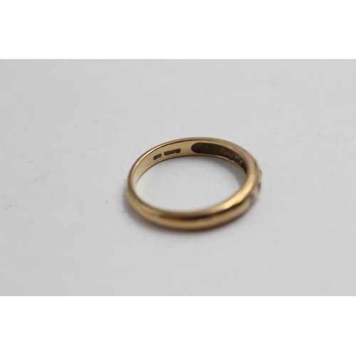 2142 - A 9ct gold diamond flush set ring, size M½ - approx. gross weight 2g