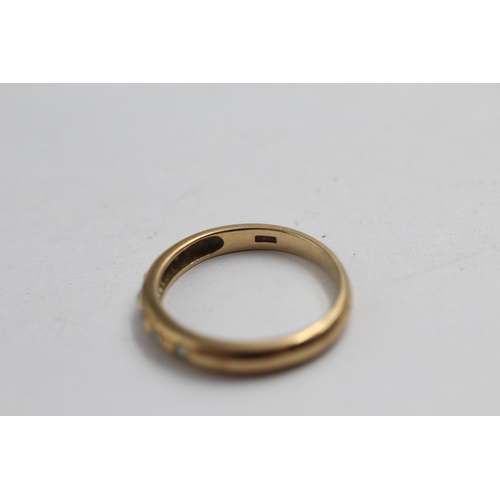 2142 - A 9ct gold diamond flush set ring, size M½ - approx. gross weight 2g