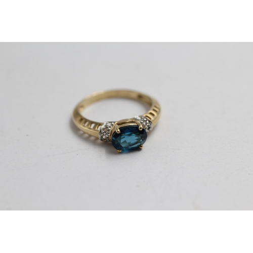 2143 - A 9ct gold blue topaz and diamond statement ring - approx. gross weight 2.7g