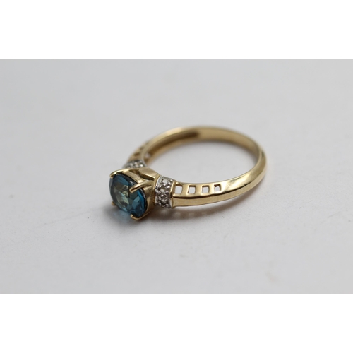 2143 - A 9ct gold blue topaz and diamond statement ring - approx. gross weight 2.7g