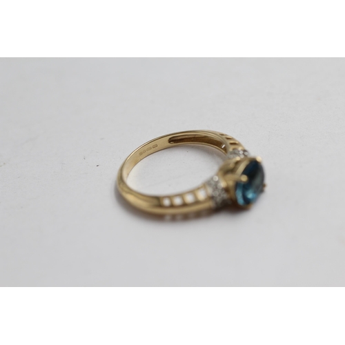 2143 - A 9ct gold blue topaz and diamond statement ring - approx. gross weight 2.7g