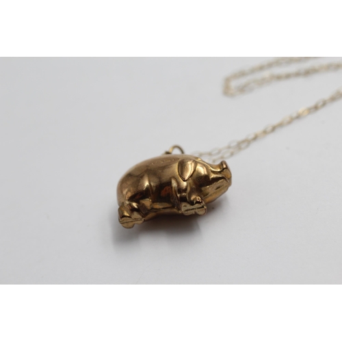 2144 - A 9ct gold lucky pig pendant necklace - approx. gross weight 2.3g